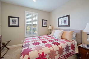 Bedroom with light colored carpet