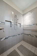 Bathroom featuring a tile shower