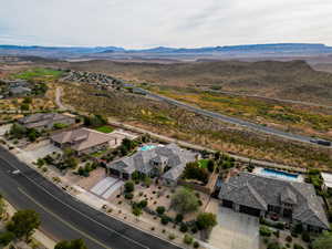 Birds eye view of property featuring a mountain view