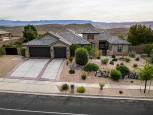 View of front facade featuring a garage and a mountain view