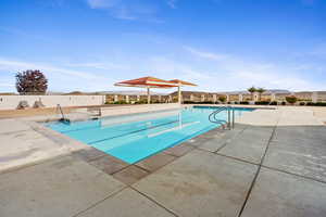 View of pool with a gazebo and a patio