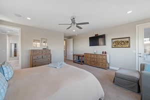 Bedroom with light carpet and ceiling fan