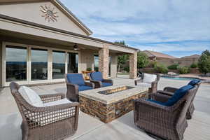 View of patio / terrace featuring french doors, ceiling fan, and an outdoor fire pit