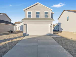 Front facade with a garage and cooling unit