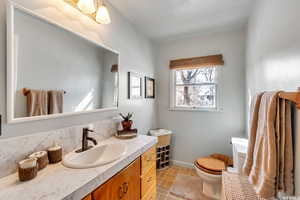 Bathroom with vanity and toilet