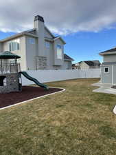 View of yard featuring a playground