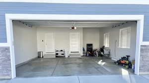 Garage featuring a garage door opener