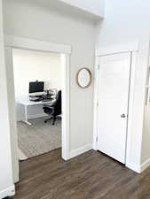 Office space featuring dark hardwood / wood-style flooring