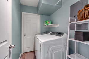 Clothes washing area with washer and clothes dryer