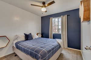 Bedroom featuring carpet floors and ceiling fan