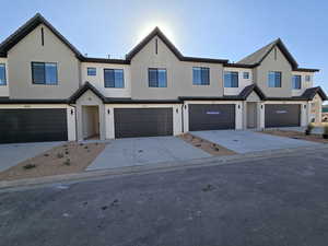 View of property with a garage