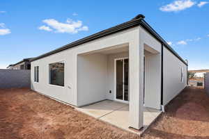 Rear view of house with a patio area