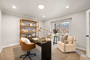 Carpeted office featuring ornamental molding