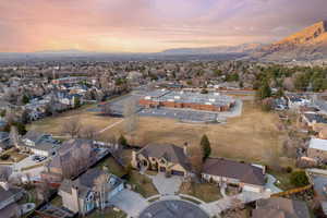 Aerial view at dusk featuring a mountain view