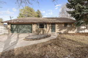 Single story home featuring a garage