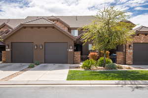 View of front facade featuring a garage