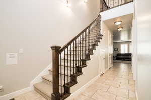 Staircase with tile patterned floors