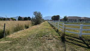 View of yard with a mountain view and a rural view