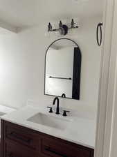 Bathroom featuring vanity and a textured ceiling