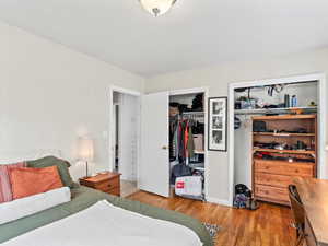 Bedroom with light hardwood / wood-style flooring