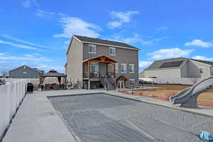 Back of property with a gazebo