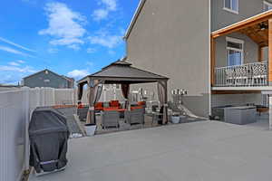 View of patio featuring a grill, a gazebo, and an outdoor hangout area