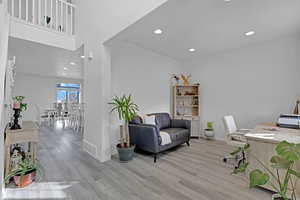 Home office with light hardwood / wood-style flooring