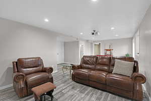 Living room with light hardwood / wood-style flooring