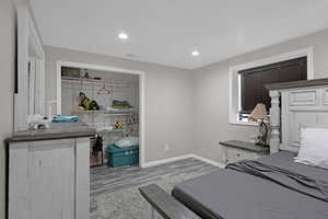 Bedroom featuring wood-type flooring