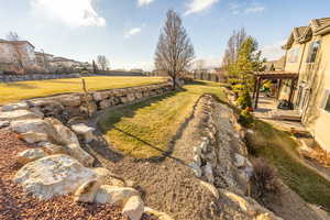 View of yard featuring grassy expanse