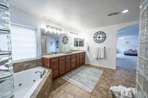 Master bath with corner tub and massive walk-in shower with dual shower heads