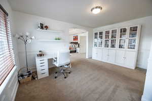 View of carpeted master suite sitting room