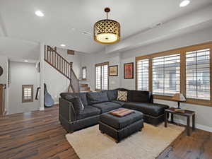 Living room with dark hardwood / wood-style floors