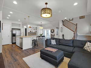 Living room featuring dark hardwood / wood-style flooring and sink