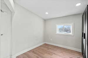 Unfurnished bedroom with light hardwood / wood-style floors