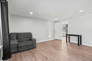 Living area with light wood-type flooring