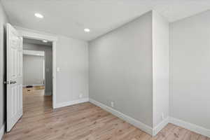 Unfurnished room with light hardwood / wood-style flooring