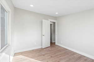 Spare room with light hardwood / wood-style floors