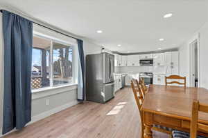 Dining room featuring light wood-type flooring