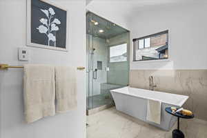 1st Primary Bathroom with large tub and walk in shower.