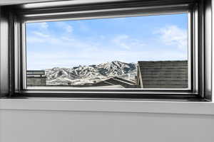 Loft window featuring a mountain view