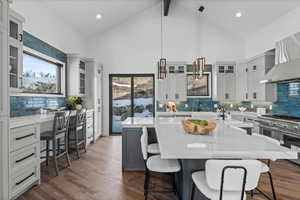 Another angle of the kitchen showing more of the breakfast bar and back sliding door to patio.