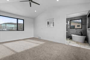 2nd primary bedroom featuring large windows and open concept bathroom.