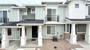 View of front of home with central air condition unit