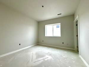 Empty room featuring a textured ceiling