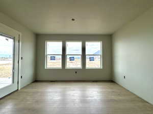 Spare room with light hardwood / wood-style floors