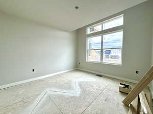 Empty room featuring a textured ceiling