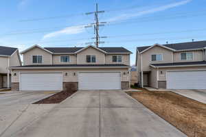 View of front facade featuring a garage