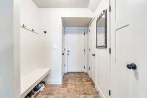 Mudroom with a barn door