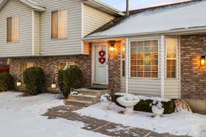 View of snow covered property entrance